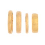 Four 22ct gold wedding rings, 21.3g, size J, O, P Light wear