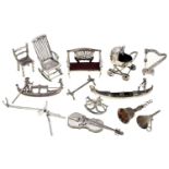 Miscellaneous Elizabeth II and Italian silver toys, including a perambulator, chairs, gondola and