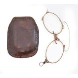Spectacles. A gold pince nez or nose spectacles, late 19th c, unmarked, leather wallet