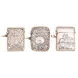 A silver vesta case, die stamped with two racehorses, 50mm, marked 925, another, marked Sterling and