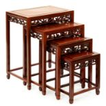 A set of South East Asian carved hardwood quartetto tables, 20th c, 66cm h; 35 x 51cm Good