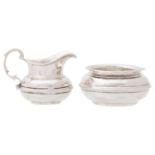 An Edwardian silver cream jug and sugar bowl, sugar bowl 95mm diam, marks rubbed, Chester 1909, 6ozs