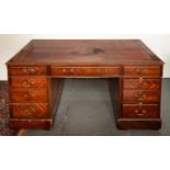 A mahogany partner's desk, second quarter 20th c, both sides in matched chevron quarter veneers