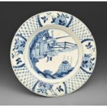 A Bow blue and white plate, c1760, painted after a Chinse Kangxi original with a warrior, the diaper