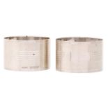 A pair of George VI silver napkin rings, maker H Bros, Birmingham 1943 and 1944, 2ozs Good