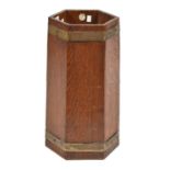 An hexagonal brass bound oak stick stand, R A Lister & Co Ltd Makers Dursley England, c1930, 50.