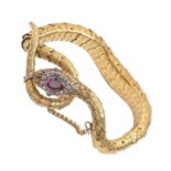 A Victorian gold serpent bracelet, the head mounted with oval amethyst in diamond surround, 21cm