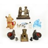 A pair of Austrian cold painted terracotta pug dog and cat and top hat spill holders, late 19th c,