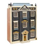 A Georgian style painted wood and otherwise ornamented doll's house, 67cm h Requires some cosmetic