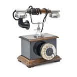 A varnished wood and chromium plated metal table telephone,  30cm h Good condition, mechanism