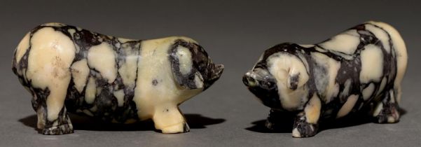 A pair of South East Asian soapstone carvings of pigs, 95mm l Minor grazes and scratches