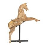 Fairground art. A painted wood galloper, circa late 19th c, 130cm l, iron stand Condition evident