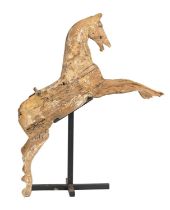 Fairground art. A painted wood galloper, circa late 19th c, 130cm l, iron stand Condition evident