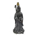 A Chinese bronze sculpture of a female immortal, late 19th/early 20th c,  holding a flower in a