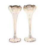 A pair of George V silver floriform vases, 18.5cm, by Sanders & Hill, Birmingham 1910, loaded