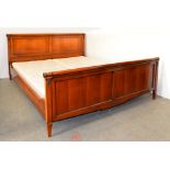 A cherry wood bed, in Empire style, with bronzed metal mounts, recent manufacture, 196cm w Good