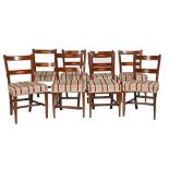 Eight early Victorian mahogany and inlaid dining chairs, the crest and back rails with satinwood