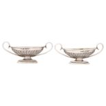 A pair of Victorian vase shaped silver salt cellars, 76mm over handles, by Saunders & Shepherd,