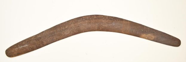 An Australian aboriginal wood boomerang, first half 20th c, 67.5cm l Old water stains and old dirt