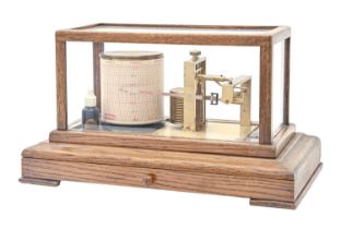 An oak barograph, F Darton & Co Ltd Watford, No B1009, with lacquered brass mechanism Working order,