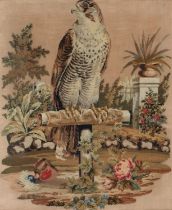 A Victorian Berlin woolwork picture of  falcon on a perch in a garden with glass eye, 67 x 55cm