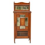 An Edwardian rosewood and inlaid music cabinet, with mirror inset upstand, the partly glazed