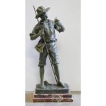 A verdigris-patinated spelter sculpture of Tom Sawyer fishing, late 20th c, stepped marble plinth