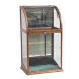 A glazed mahogany cylinder front taxidermy or other case, early 20th c, with mirror back, 108cm h;