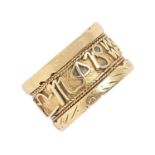 An Ethiopian gold ring, the band with applied calligraphy, 8.5g, size L Scratched from wear