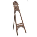 A North Indian carved and pierced wood easel, c1900, 179cm h Small losses and repairs