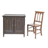 An oak chair, early 20th c, with triple arched gothic style back and boarded seat and a black