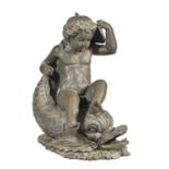 Garden statuary. A brass sculpture of a boy on a dolphin, late 20th c, 70cm h Atmospheric patina;