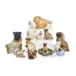 Seventeen Continental biscuit and glazed porcelain zoomorphic and other models of pug dogs, late