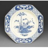 An octagonal Bow blue and white plate, c1756-60, painted with a prominent flower and large leaf