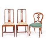 A pair of mahogany dining chairs, early 20th c, with pierced splat and a Victorian walnut dining