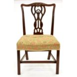 A George III mahogany dining chair, with anthemion-centred, interlaced splat, the serpentine seat on