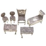 Six Continental silver toys, c1900, all furniture, comprising three chairs, two tables and a