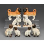 A pair of Schmidt & Co Victoria Porcelain models of pug dogs, c1890 and three pairs of