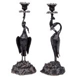 A pair of bronze 'stork' candlesticks, attributed to Thomas Abbott, 19th c, the fish in the bird's
