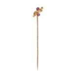 An Edwardian gold stickpin, the terminal set with two rubies, head 11mm, marked 15ct, 1.5g Good