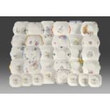 A collection of thirty two Shelley bone china two handled plates and side plates, c1930-40,