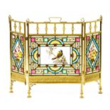 A Victorian folding brass and stained glass firescreen, painted with a bird on blossom and