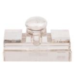 An Edwardian silver mounted glass inkwell, with two lidded postage stamp compartments and pen