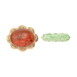 An hexagonal carved and pierced jadeite brooch, with peaches and leaves, mounted in 9ct gold,