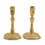 A pair of English brass candlesticks, 19th c, with pierced octagonal sconce, on dished foot, 16.