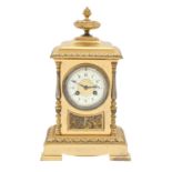 A French gilt and silvered brass mantel clock, of pillar shape with primrose enamel dial and gong