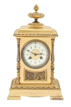 A French gilt and silvered brass mantel clock, of pillar shape with primrose enamel dial and gong