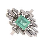 An emerald and diamond ring, the step cut emerald 5 x 6mm, in asymmetrical surround of baguette