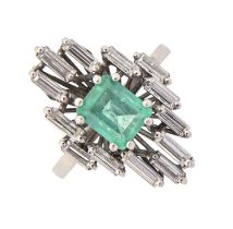 An emerald and diamond ring, the step cut emerald 5 x 6mm, in asymmetrical surround of baguette