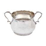 An Edwardian silver sugar bowl, hammer textured, 85mm h, by Deakin & Francis Ltd, Birmingham 1905,